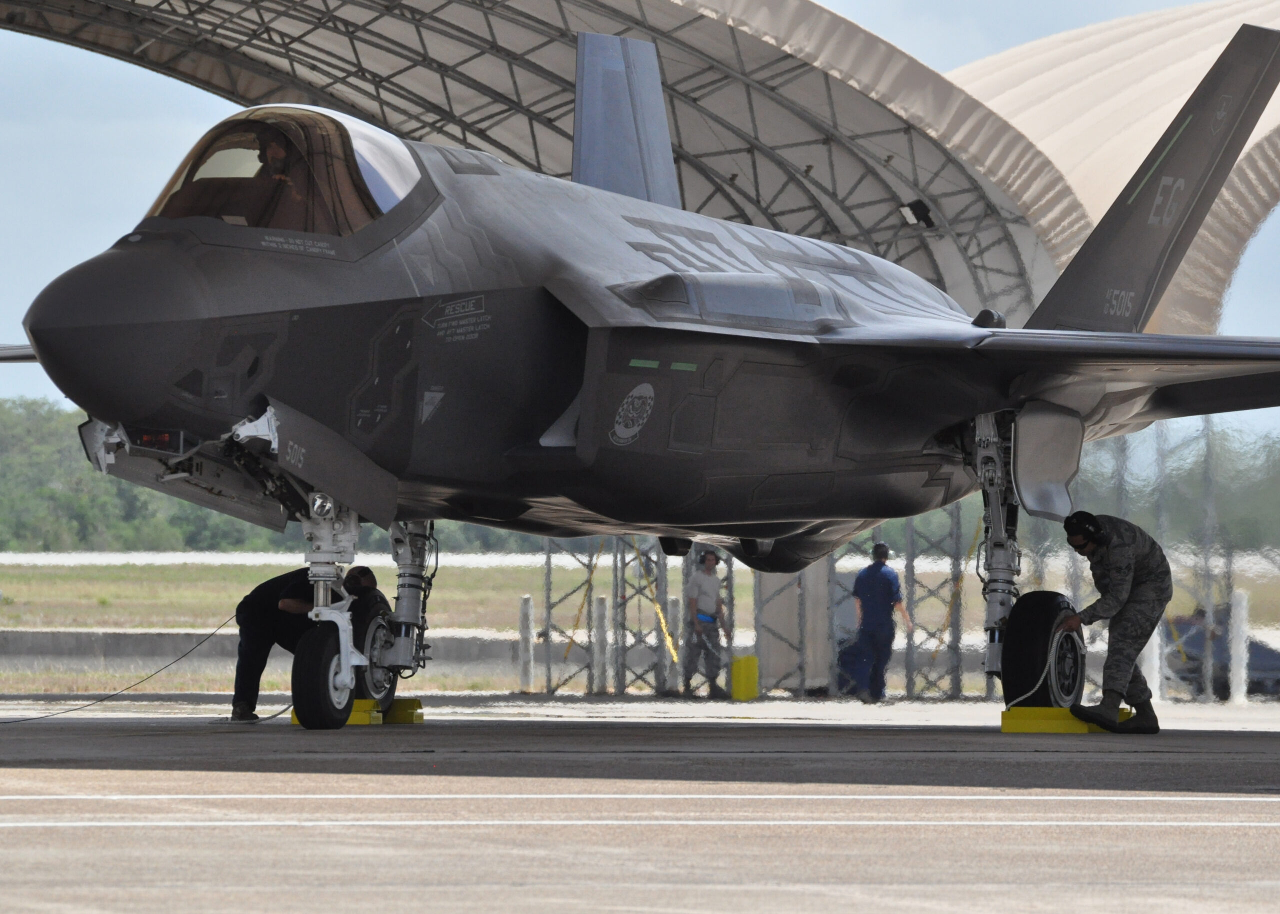 military-jet-is-being-serviced-by-man-canopy