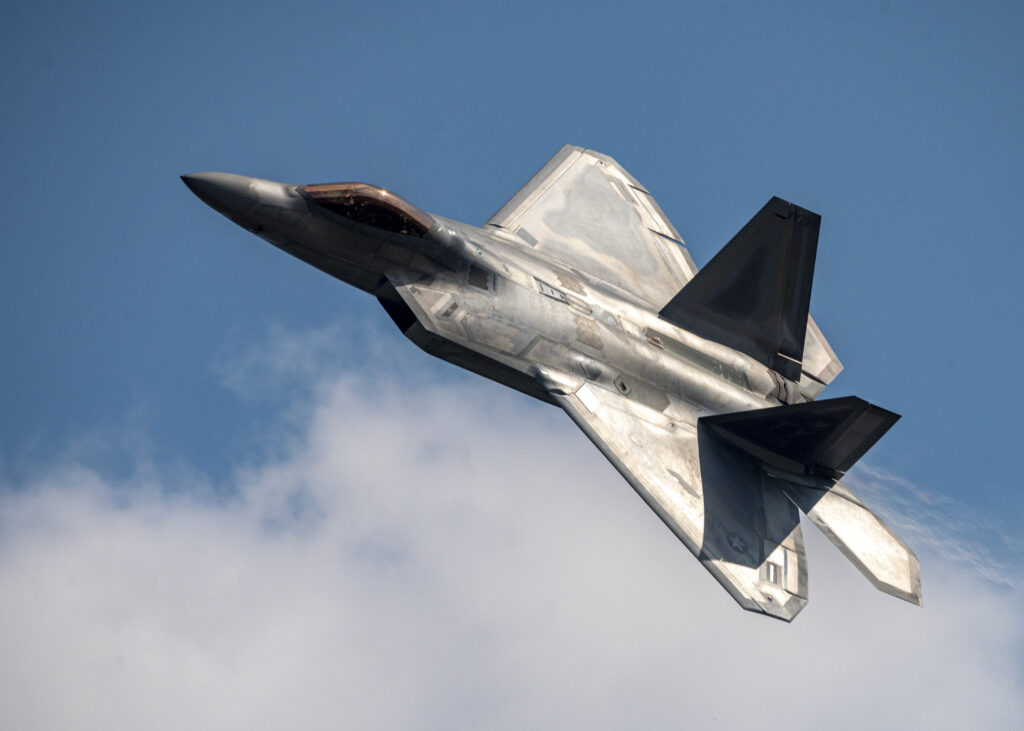 silver-fighter-jet-is-flying-sky